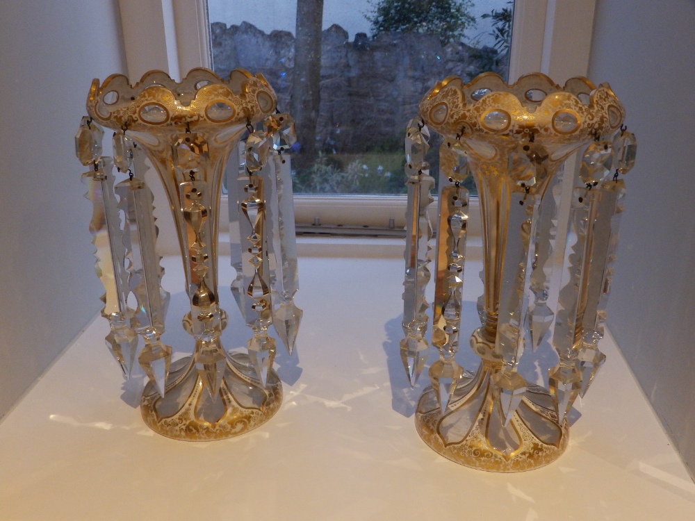 A pair of 19thC gilded opaque glass lustres, 11" high - one rim incomplete.