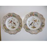 A pair of German porcelain painted ribbon plates by Helena Wolfsen decorated birds - 'AR'.