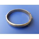 A 9ct gold bangle.