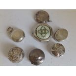 A silver sovereign holder - Chester 1904 and six silver and other pill boxes. (7)