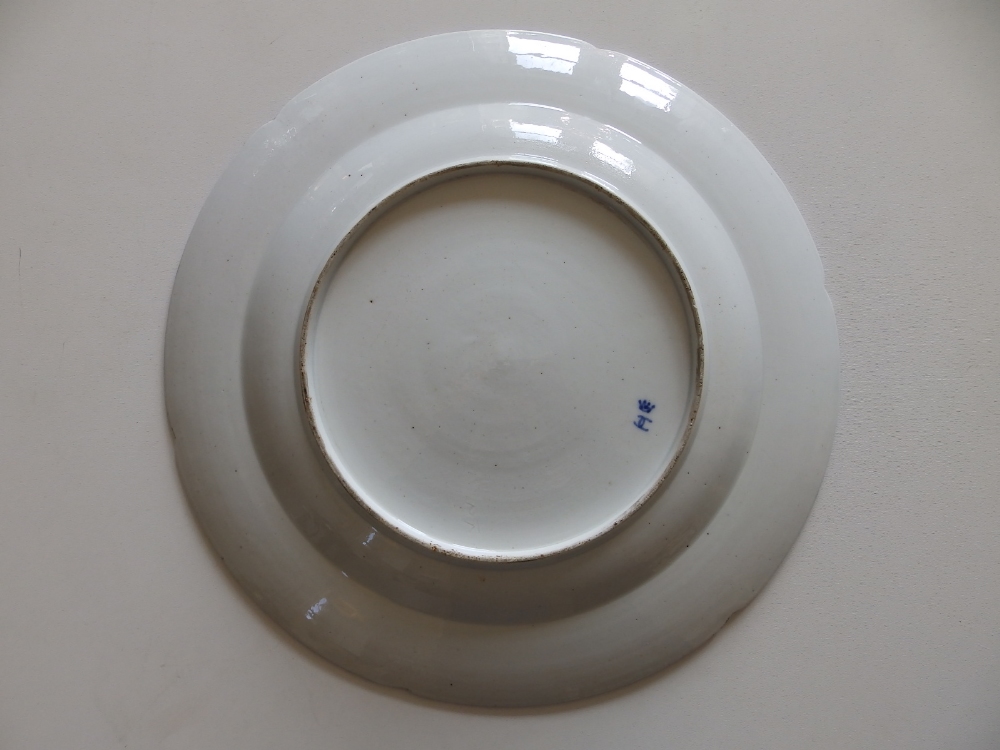 A Ludwigsburg porcelain charger, painted with scattered floral sprigs, blue painted rim, 13.8" - Image 2 of 2