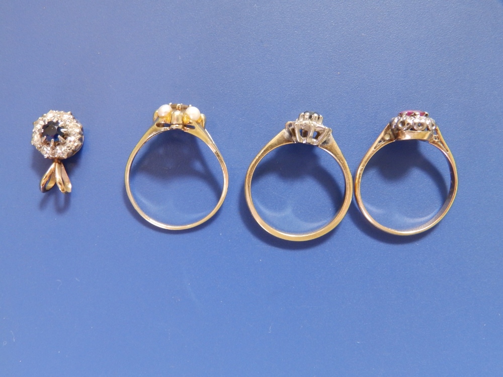 A small ruby & diamond cluster ring, two other cluster rings and a pendant. (4) - Image 2 of 2