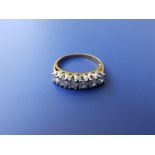 A modern six stone diamond 18ct gold ring - each stone approximately 0.15 carat Finger size O/P
