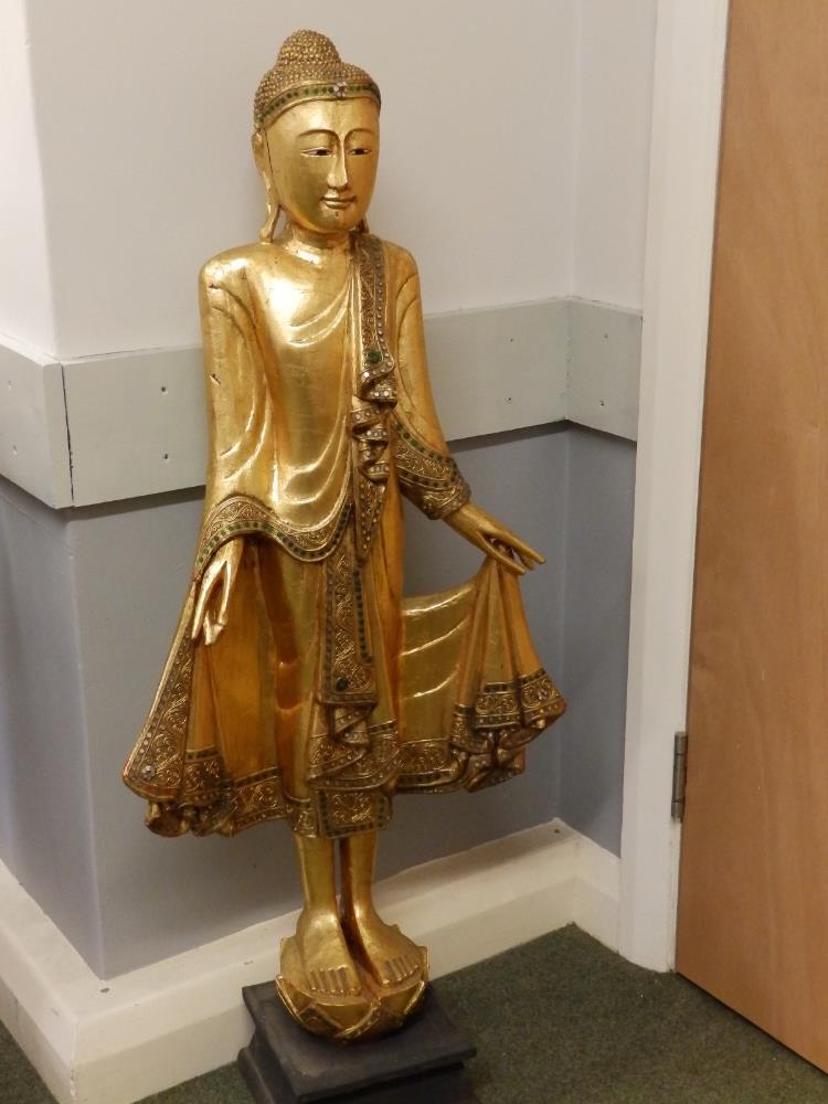 A 20thC gilded wood standing figure of a Buddha/Angel, 44" high.