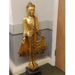 A 20thC gilded wood standing figure of a Buddha/Angel, 44" high.