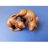 A 20thC signed Japanese wood netsuke carved to depict two mice.