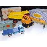 A boxed Corgi Platform Lorry ERF Model 44G, together with a boxed Dinky 924 Centaur Dump Truck and a