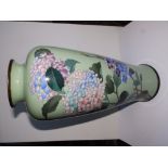 A Japanese Meiji period cloisonne vase decorated lilac blossom against a celadon green ground, 18" -