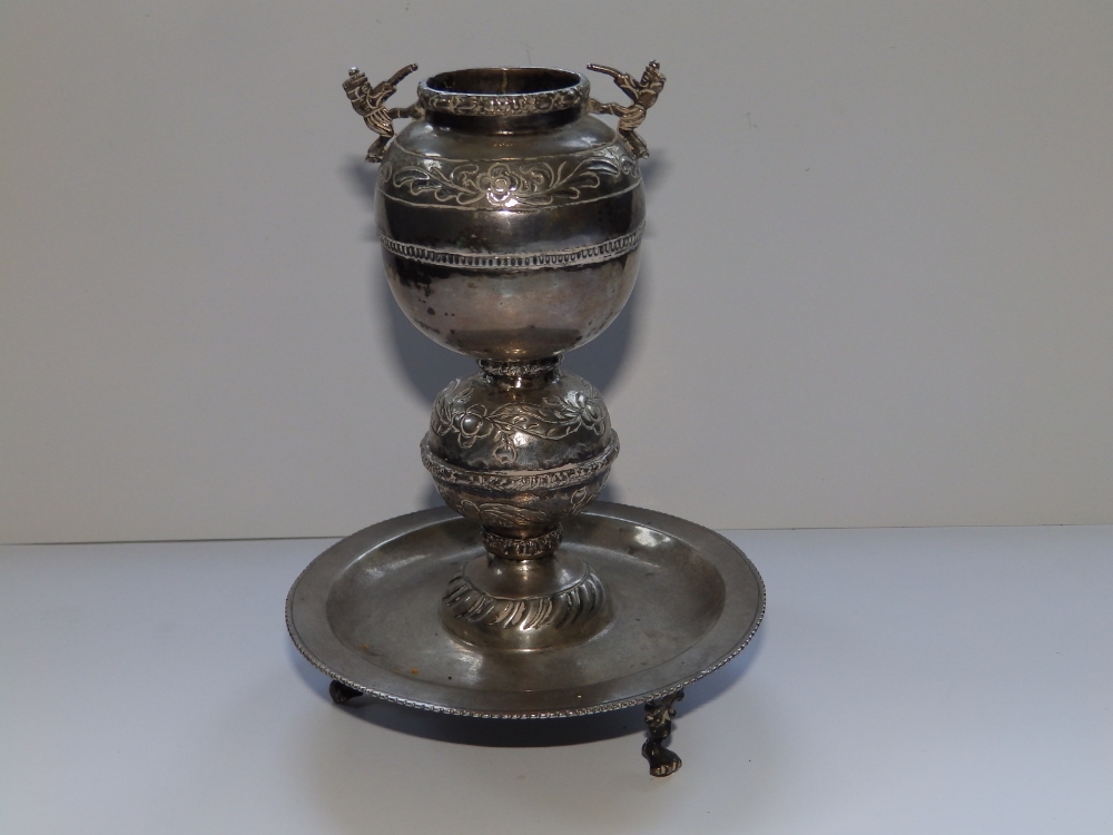 A 19thC Eastern metal incense burner(?) , the circular tray base on triple feet, 7" high.