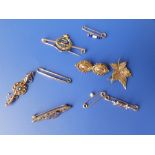 Nine Victorian and other gold brooches.