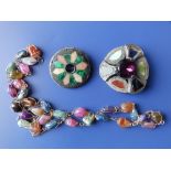 A multi-coloured quartz pebble necklace and two damaged Scottish brooches. (3)