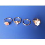 Two cameo rings, a coral ring and a thin 22ct gold wedding band. (4)