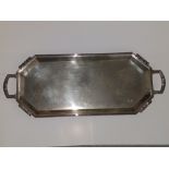 An art deco silver two-handled tea tray of canted rectangular shape with reeded borders - Walker &