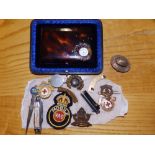 A pair of Concorde nail clippers, a small quantity of military badges and other items.