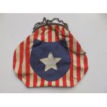 A purse sewn with fabric in the style of the American Confederate flag.