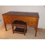 A 19thC Chinese golden lacquered kneehole dressing table and matching stool, the table with an