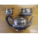 An Edwardian silver three piece bachelor's tea service - Birmingham 1905 - marks rubbed.