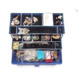 A folding box and contents of costume jewellery.