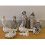 Three Nao porcelain doves and six other Nao figures/groups. (9)