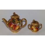 A miniature Royal Worcester fruit painted teapot, 4" across and a two-handled covered sugar basin.