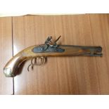 A reproduction flintlock pistol.