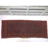 A small old Bokhara pattern red ground runner, 39" x 14.5".