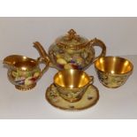 A Royal Worcester fruit painted four piece solo tea serice, the cream jug, sugar bowl and teacup