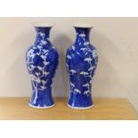 A pair of Chinese blue & white hawthorn pattern vases with concentric blue circle marks to
