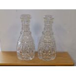 A pair of triple ring cut glass decanters, 10.5" high.