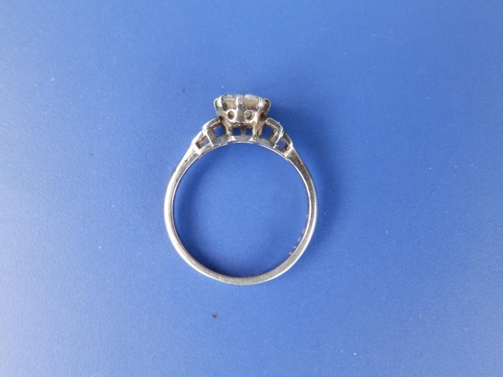 A diamond solitaire, the claw set brilliant weighing approximately 0.60 carat, small diamonds to - Image 2 of 2