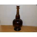 A brown mottled glaze Doulton Lambeth bottle vase.