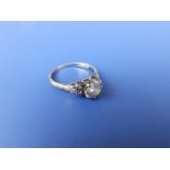 A diamond solitaire, the claw set brilliant weighing approximately 0.60 carat, small diamonds to