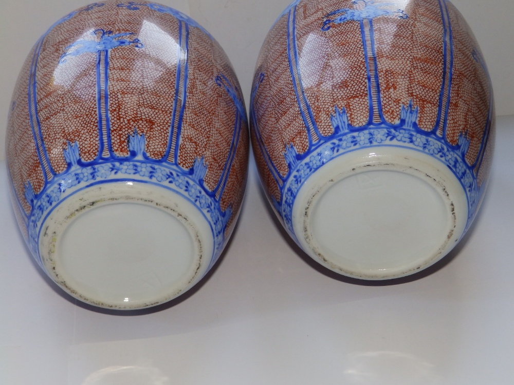 A pair of 20thC Oriental covered vases, 10" high. - Image 3 of 3