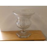A 19thC urn shaped cut glass vase on hexagonal foot, 9.5".