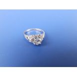 A diamond solitaire, the high claw set brilliant weighing approximately 0.50 carats, small