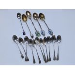 11 Sheffield silver coffee spoons and five continental .800 souvenir spoons. (18)