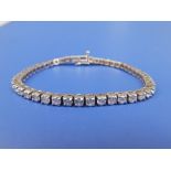 A diamond line bracelet, the 47 round cut stones of total weight approximately 5 carats in four-claw