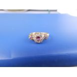 A small late 19th/early 20thC ruby & diamond 18ct gold cluster ring - Chester marks. Finger size K.