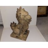 A Doulton Lambeth unglazed stoneware Chinese lion - 'BT' - minor loss to head.