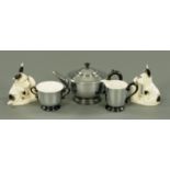 An Art Deco ceramic and chrome Patent tea service, and a pair of Ware puppy bookends.