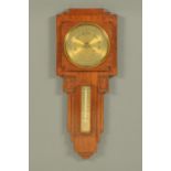 An Art Deco period oak wall mounted barometer. Height 59.5 cm.