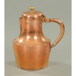 A 19th century copper jug, with hinged lid. Height 35 cm.