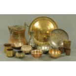 A quantity of Eastern metalware, comprising containers, dished plates, vases, bowls and tumblers,
