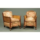 A pair of bergere armchairs, with walnut frames,