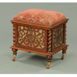 A Victorian mahogany music stool, with stuffover top,