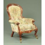 A Victorian mahogany gentleman's armchair, with exposed showframe, deep buttoned back,