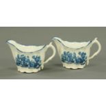 A pair of 20th century blue and white small sauce boats, decorated with Chinoiserie scenes.