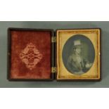 A good relief moulded vulcanite folding photograph frame, late 19th century,
