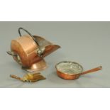 A 19th century copper coal scuttle with bale handle, brass coal shovel and a copper shallow pan.