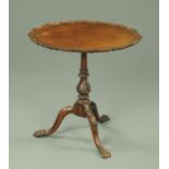 An Edwardian mahogany oval occasional table, with piecrust edge,